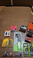 Wide overview showing arrangement of drill bits, rivet tool, socket bits and wire wheel brush