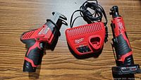 Overview of M12 Hackzall, M12 charger, and M12 ratchet with battery