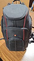 Front view of black and red Manfrotto backpack