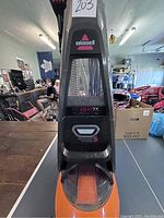 Front view of Bissell ProHeat 2X carpet cleaner showing brand label and heatwave feature