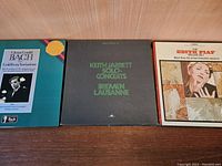 Front view of the three vinyl record box sets: Glenn Gould Bach, Keith Jarrett Solo Concerts, and Edith Piaf Deluxe Set.