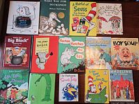 Top view of 14 children's books displayed flat, covers visible