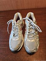 Front view of pair of New Balance running shoes showing mesh upper and laces.