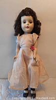 Front view of the 15-inch vintage Sweet Sue Walker doll in pink organza dress, showing facial features and outfit.