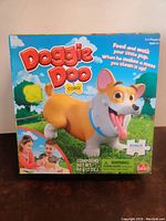 Front of Doggie Doo Corgi game box showing corgi dog and title.