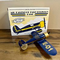 Photo showing airplane bank and original box with "Air Eastwood Fast Delivery Bank" branding.