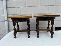 Pair of vintage oak pegged end tables showing front and side profile with turned legs and stretcher connecting legs.