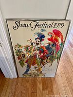 Full view of the framed vintage Shaw Festival 1979 poster with colorful theatrical illustration and red parrot.