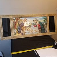 Full view of vintage framed nativity lithograph showing entire piece and measuring tape indicating size