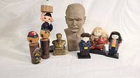 Overview of busts and wooden and ceramic Japanese doll figures