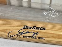 Close-up of the bat showing the Big Stick Professional Model stamp and Dennis Eckersley autograph with #43.