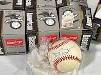 Rawlings Official American League baseball box set with autographs visible on baseballs and box labels, including J.D. Stewart signature dated 6/2/92.