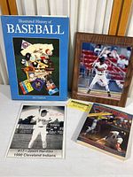 Photo showing the five different items including the framed Royce Clayton photo plaque, two books on baseball, the Jason Hardtke signed photocopy and certificate card.