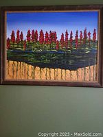 Framed landscape painting showing red cardinal flowers with underground roots and bright blue sky.