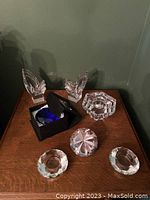 Overall view of 7 crystal pieces on wooden surface including two large Rosenthal 'Diamonds', one in its box, plus the other crystal pieces.
