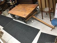 Full view of cart on showroom floor showing platform, wheels and handle