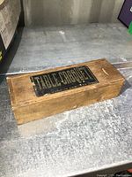 Wooden box closed with label 'TABLE CROQUET' on top