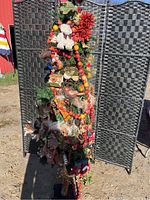 Full view of the decorated artificial Christmas tree showing overall arrangement of bird ornaments and decorative garlands.