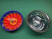 Top view of the two decorative bowls showing floral design and glass texture