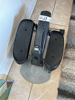 Top view of the black foot pedals and digital display.