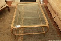 Top view showing the beveled glass top and antiqued metal frame with curved legs