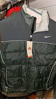 Nike ACG gray and green color-block insulated puffer jacket with original tag attached