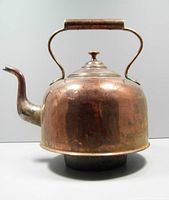 Front view of copper kettle showing domed lid with finial and handle with cylindrical grip, kettle body shows oxidation and patina.