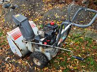 Right side view of the Craftsman 5/24 snowblower showing engine, wheels, and chute.