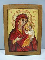 Front view showing the hand painted Madonna and Child in traditional icon style with gold and red tones, signed RM in lower right corner.