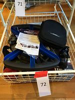 Lot contents showing Liberty Lift exercise device, Bose carrying case with headphones, gloves, manuals, and eyewear.