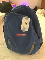 Blue Emergency Zone branded backpack on white surface