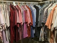 Full-length view of rack showing assorted men’s button-down shirts
