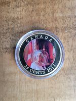 Photo of the reverse side featuring coloured portrait of Queen Elizabeth with Canadian flag and 2013 date