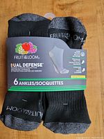 Front view of the six pairs of Fruit of the Loom ankle socks showing packaging and branding.