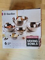Box of 6 piece stainless steel mixing bowl set by finedine with various bowl sizes shown on front