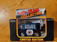 Front view of the boxed die cast Zamboni featuring San Jose Sharks logos and limited edition label.