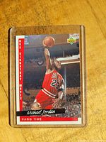 1992 Upper Deck Michael Jordan Hang Time basketball card featuring Jordan mid-dunk in Chicago Bulls uniform, pictured in protective sleeve.