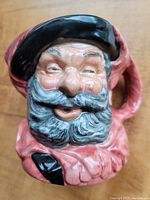 Top close-up view of the Falstaff face on the Royal Doulton Toby Mug showing detailed facial features and glaze.