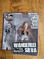 Full view of the Wanderlei Silva MMA action figure in original packaging with branding and artwork visible.