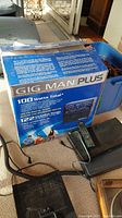 Photo showing the Gig Man Plus karaoke machine box describing 100 watts total power output and product features.