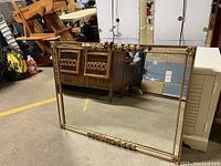 Full frontal view of the rectangular gold framed mirror showing the overall size and design.