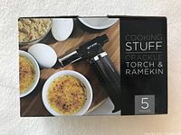 Packaged Cooking STUFF Crackle Torch and Ramekin set showing product image with torch and ramekins with creme brulee