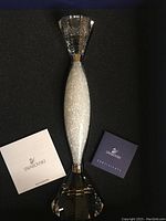 Swarovski candle holder in original box with certificate and paperwork.