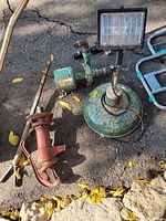 Overhead photo showing all four items on cracked asphalt with fallen leaves, depicting conditions and color details.