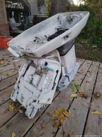 Full view of the Johnson hydraulic trim motor assembly showing white painted metal body, hydraulic cylinder, and mounting components.