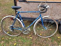 Full side view of the blue Rampar vintage road bike showing frame, wheels, and handlebars.