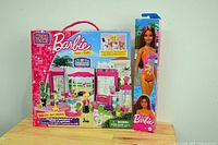 Front view of full Mega Bloks Barbie Build 'n Style Pet Shop boxed set with Barbie doll boxed alongside, both new.
