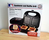 Front of box showing sandwich and waffle grill with Boston Red Sox logo imprint on cooking plates and key features like even cooking, lock-down lid, easy cleaning.