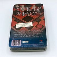 Back of metal tin box showing game titles in English and French. Full size 12 x 12 inch board with checkers, chess, and tic-tac-toe games indicated.