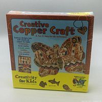 Front of the Creative Copper Craft box showing the product name, sample butterfly craft design, and usage info.